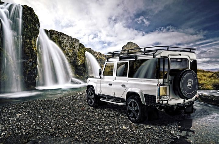 Bespoke car photography highlighting custom vehicle designs and detailing for a luxury car in the background there is a waterfall.