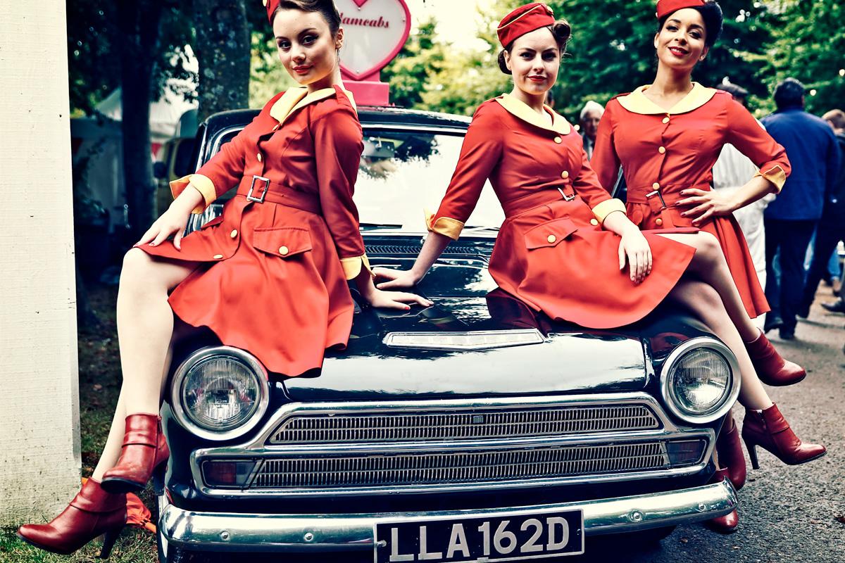 PR campaign for Mintex at Goodwood Revival 2017, Three models pose alongside a vintage vehicle.