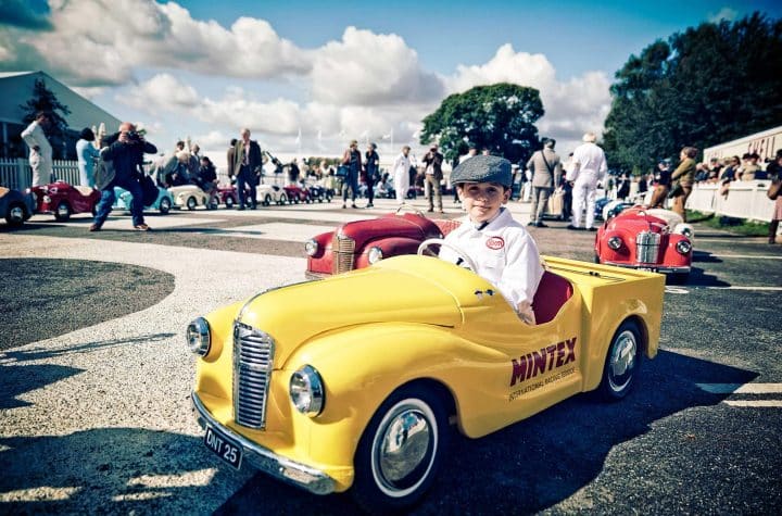 PR campaign for Mintex at Goodwood Revival 2017 a child drives a miniature vintage vehicle.